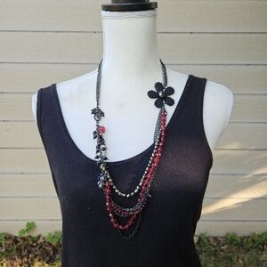 dark layered necklace with red beads flower spider fly charms